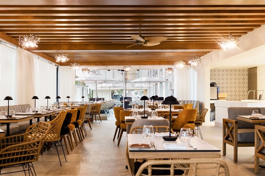 Elegant indoor and outdoor dining tables at Savia Restaurant
