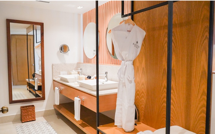 Sophisticated Scenic Studio suite layout showcasing a sleek full-length mirror, modern minimalist wardrobe, and custom luxury finishes at Kadun Hotel Boutique.